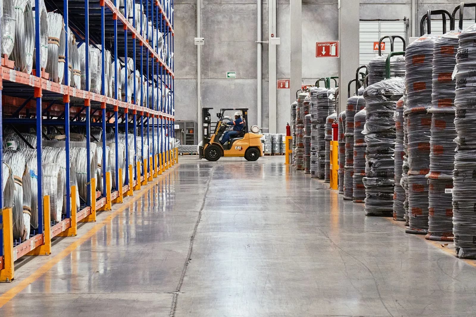 A warehouse aisle stacked with stock