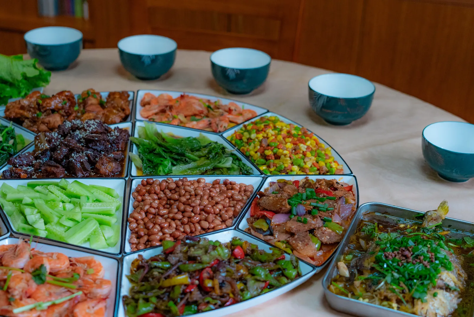 Malaysian dishes laid out on a round dining table — representing private label OEM food manufacturers in Malaysia