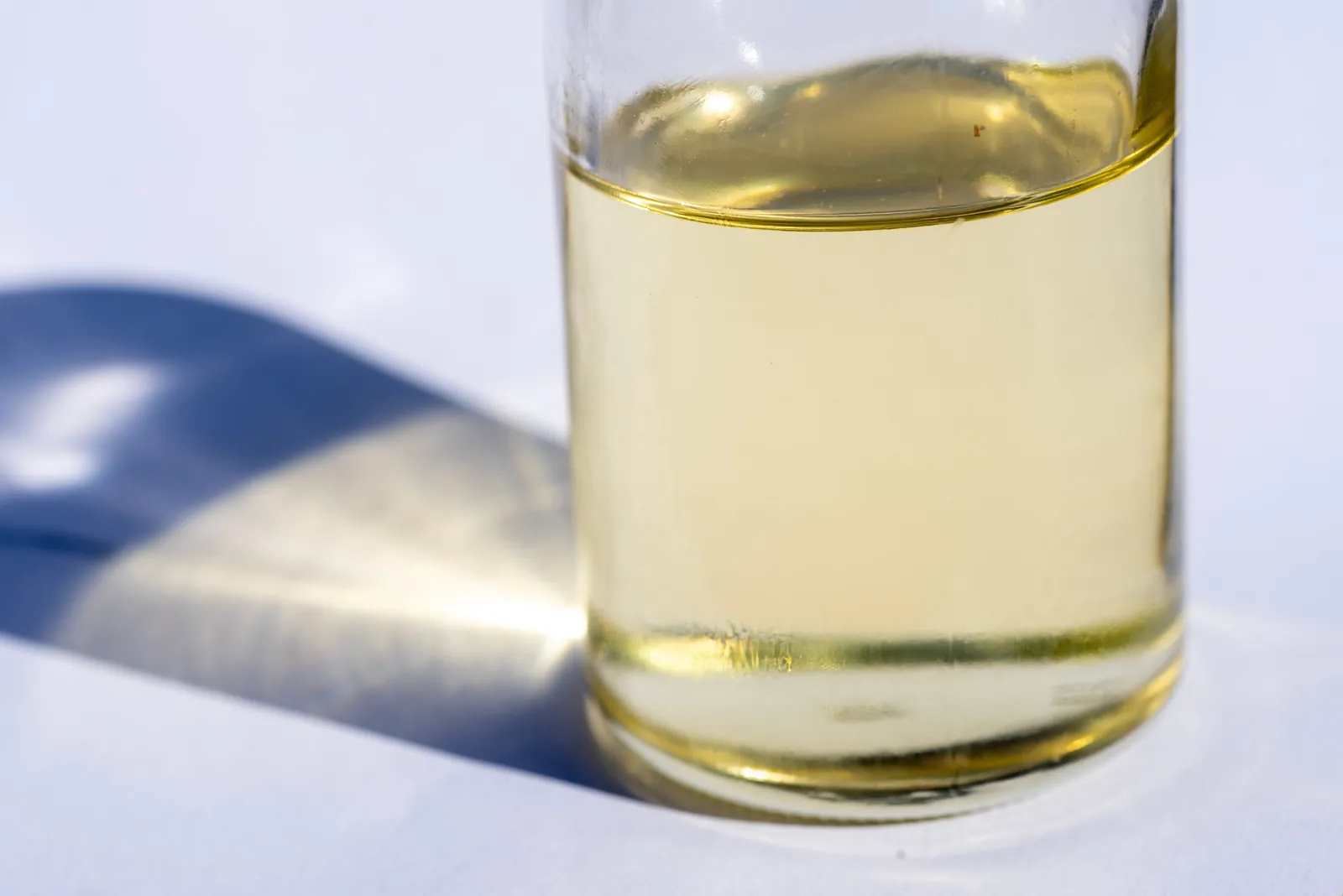 A golden liquid in a laboratory glass