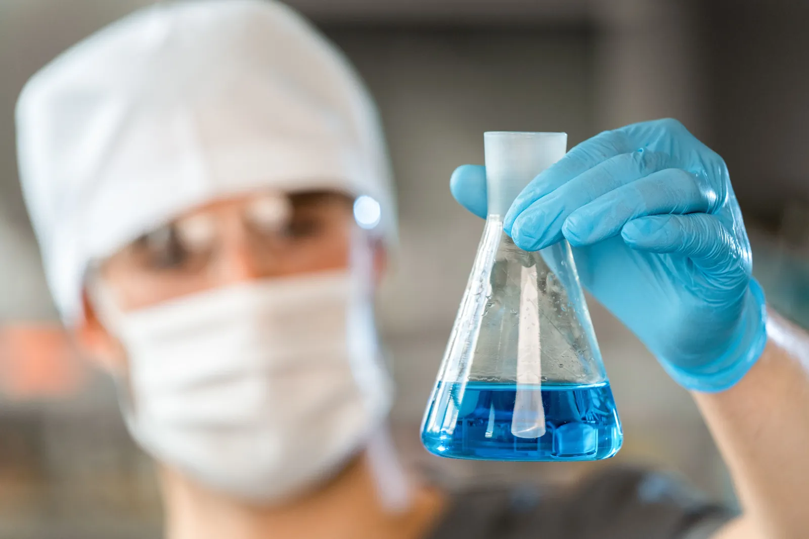 A laboratory technician examining a product sample